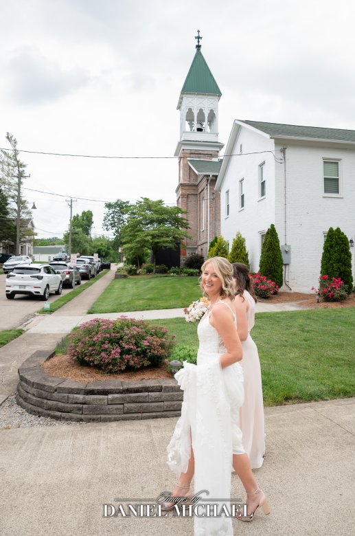 Natural True Color Photo of Bride Looking Back Walking To Church